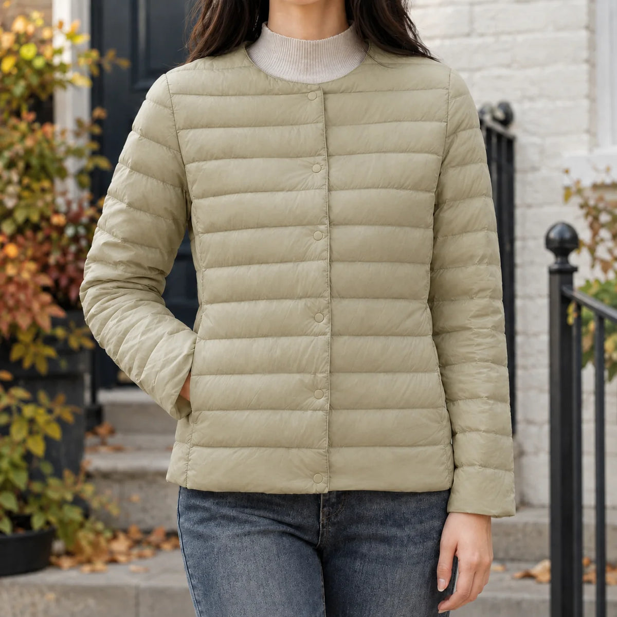 Women's white quilted jacket, snap fastening detail
