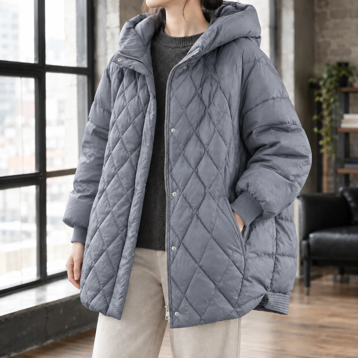 Women's black puffer jacket, hood and collar detail