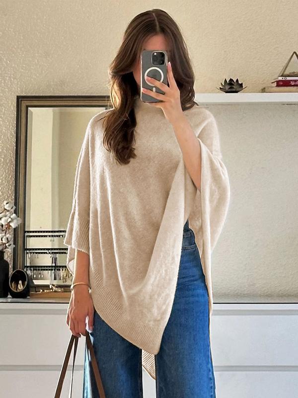 Daisy knit cape, asymmetric hem detail