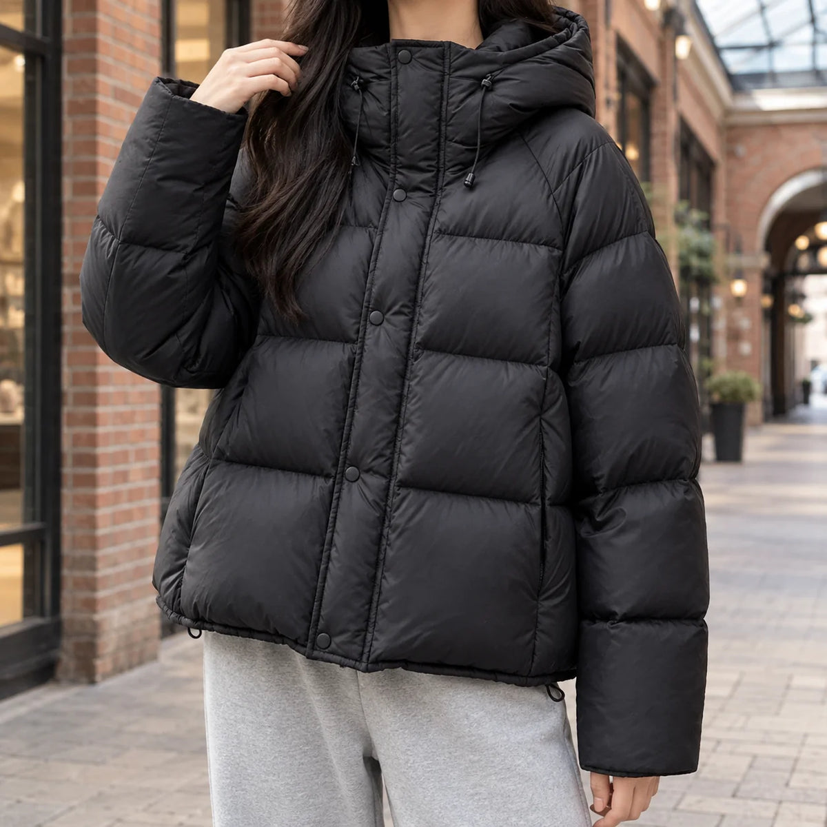 Women's black duck-down quilted jacket with adjustable hood