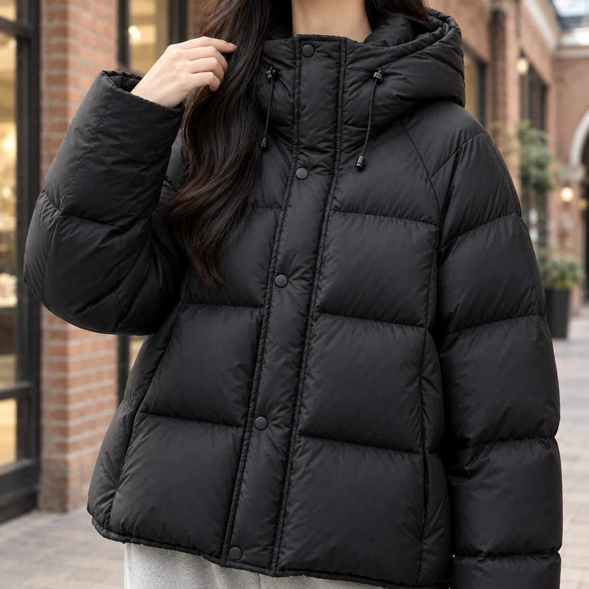 Women's white puffer jacket with zip and snap closure