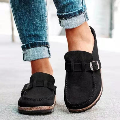 Women's black slip-on mules with buckle strap