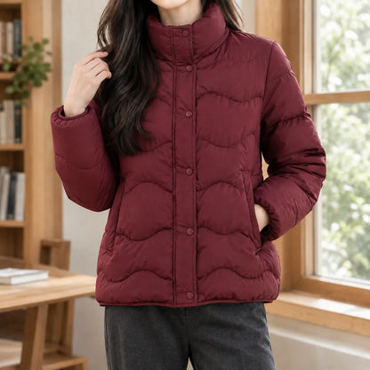 Women's beige puffer jacket with angled welt pockets