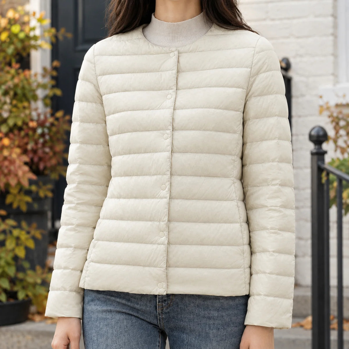 Women's black quilted jacket with tonal snap fastening