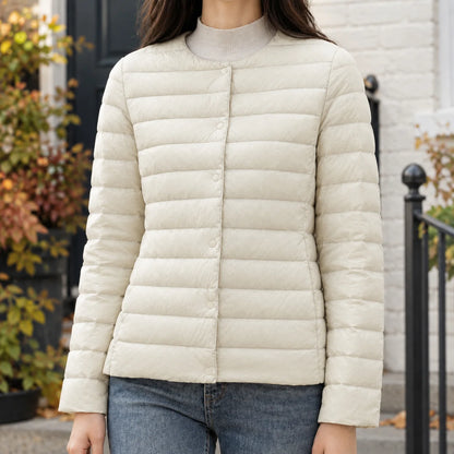 Women's black quilted jacket with tonal snap fastening