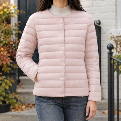 Women's beige quilted jacket, close-up of round neckline