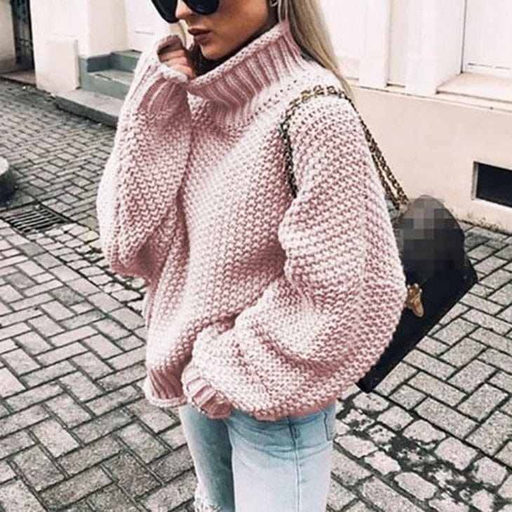 Women's light pink oversized chunky knit turtleneck sweater