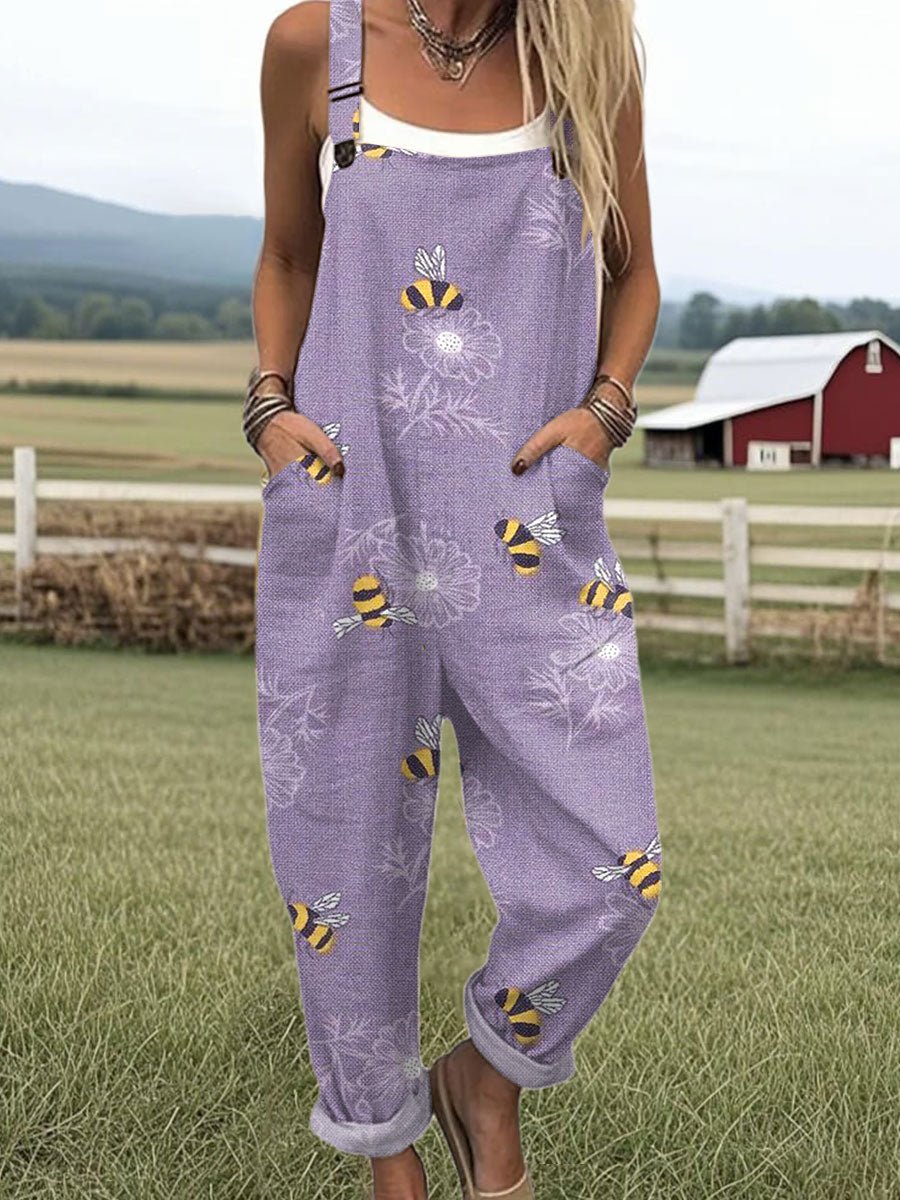 Women's purple bee and blossom print jumpsuit with adjustable straps