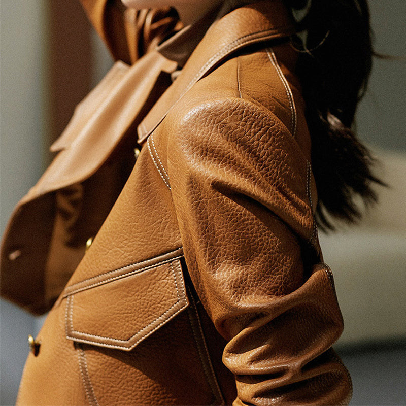Women's brown cropped faux leather jacket with oversized fit