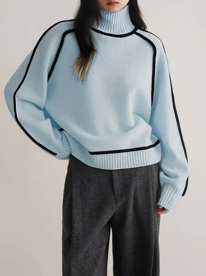Women's blue turtleneck sweater with contrast piping