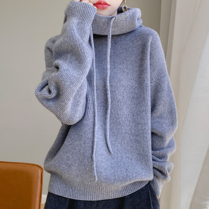 Women's green wool hooded sweater with relaxed loose fit