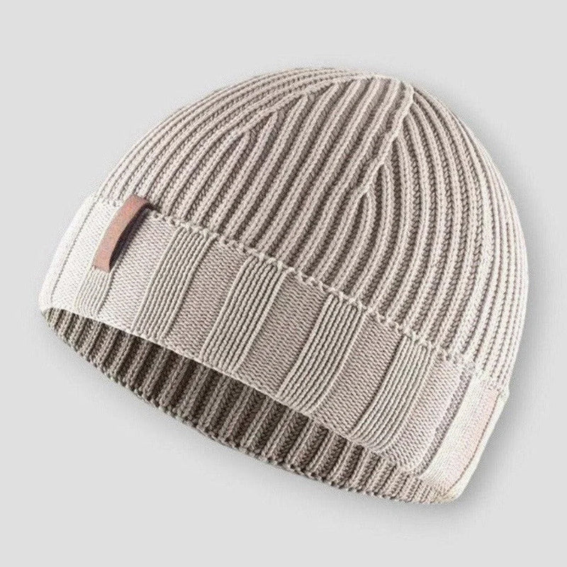 Beige knit beanie hat with vintage inspired distressed finish