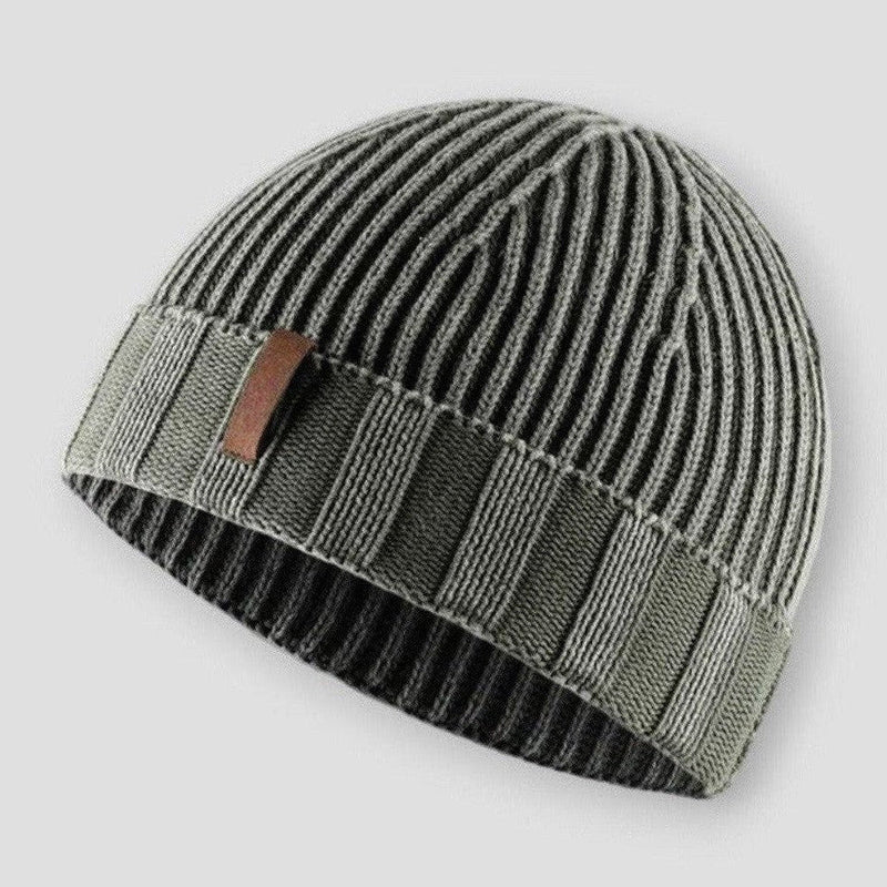 Green knit beanie hat with vintage inspired distressed finish