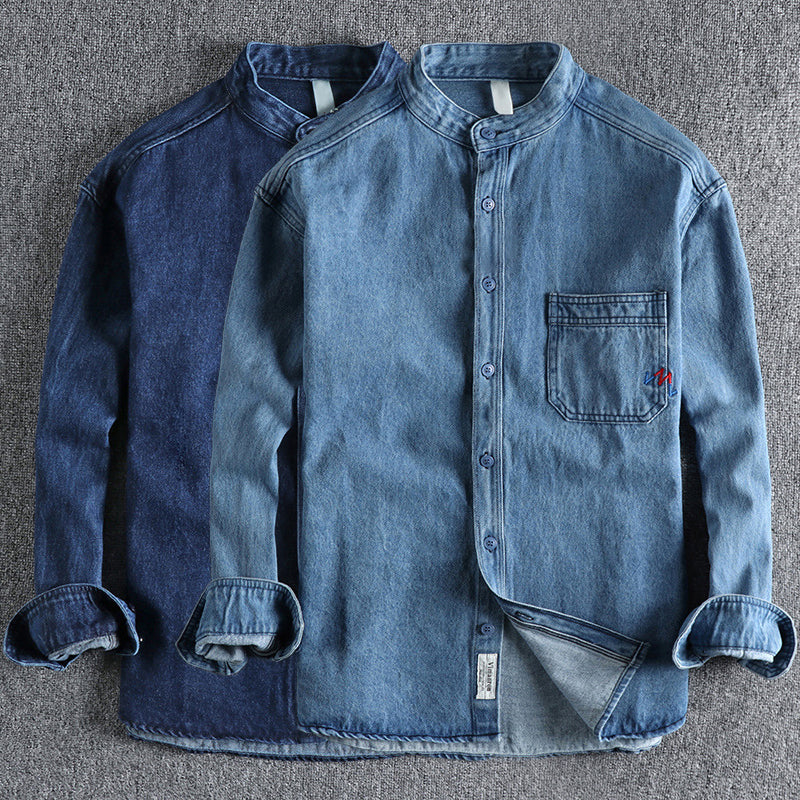 Men's light blue washed denim shirt with chest pockets and long sleeves