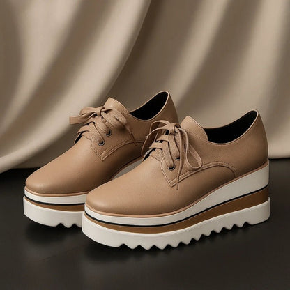 Women's beige lace-up platform oxford shoes with striped wedge sole