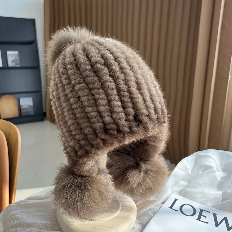 Women's brown plush winter hat with pom poms