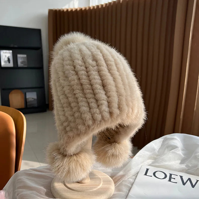 Women's beige plush winter hat with pom poms