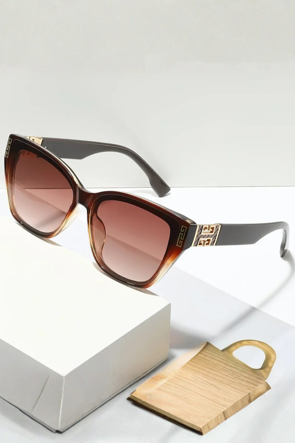 Women's black grey cat eye sunglasses with gold detail