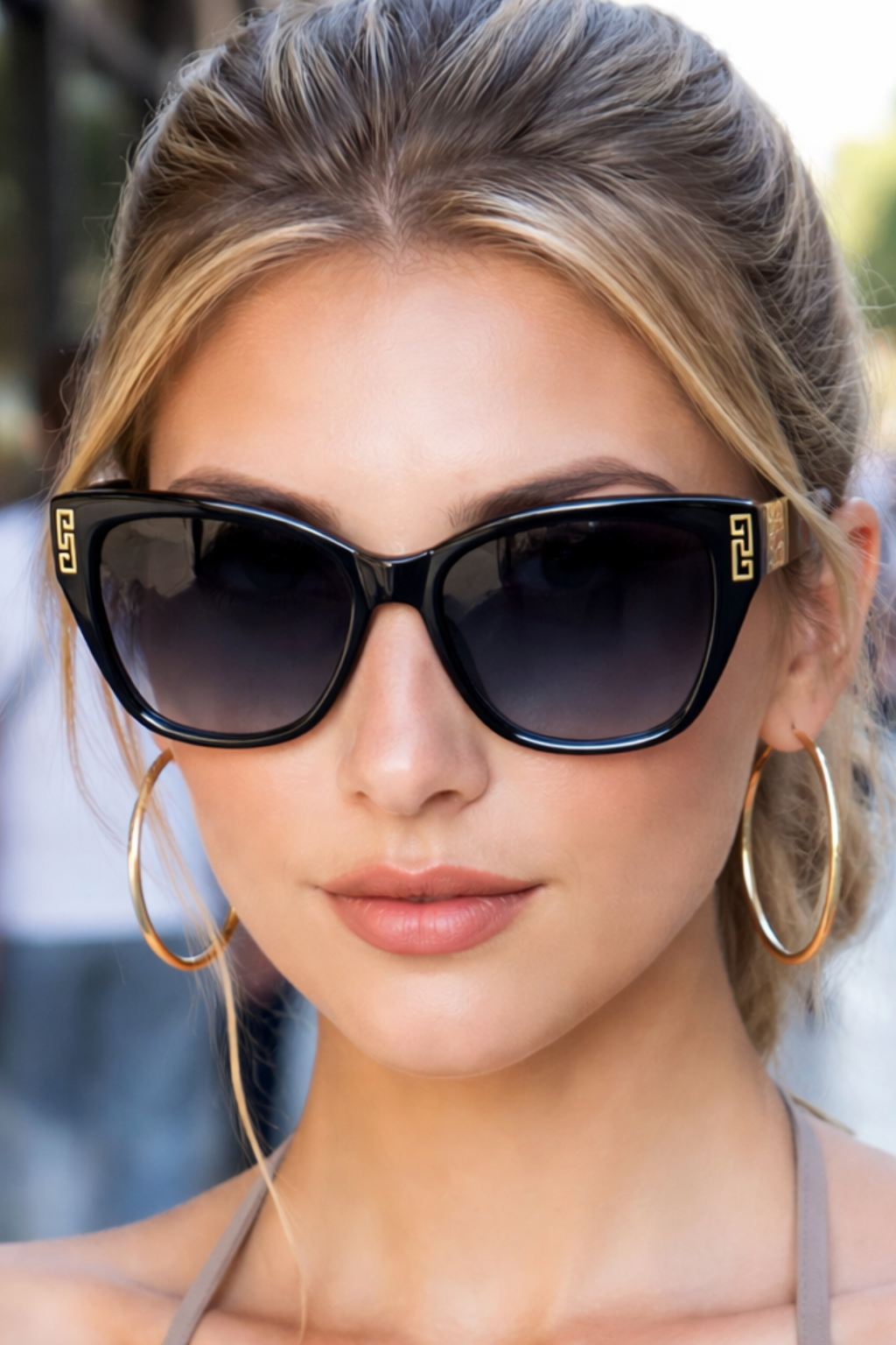 Women's blue cat eye sunglasses with gold detail