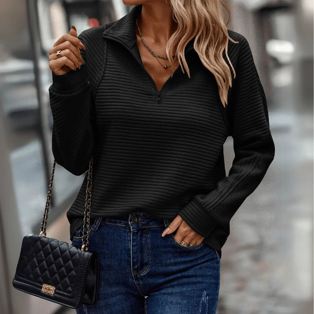 Women's black half zip pullover sweater with textured finish