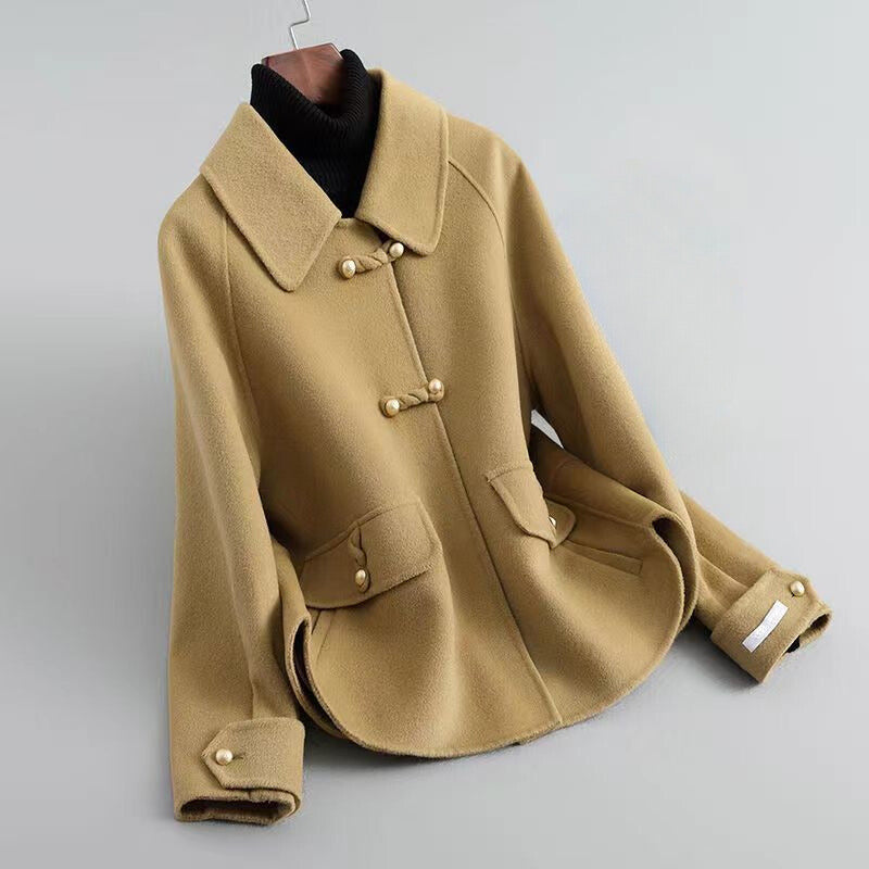 Women's beige knit coat with pearl buttons and statement collar