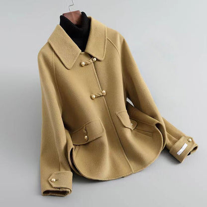 Women's beige knit coat with pearl buttons and statement collar