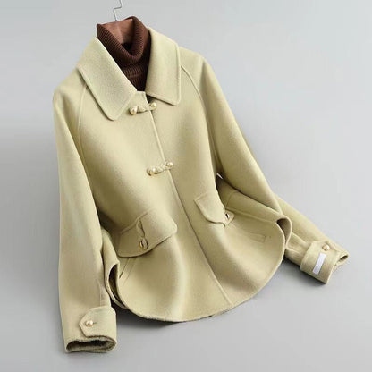 Women's beige knit coat with pearl buttons and statement collar