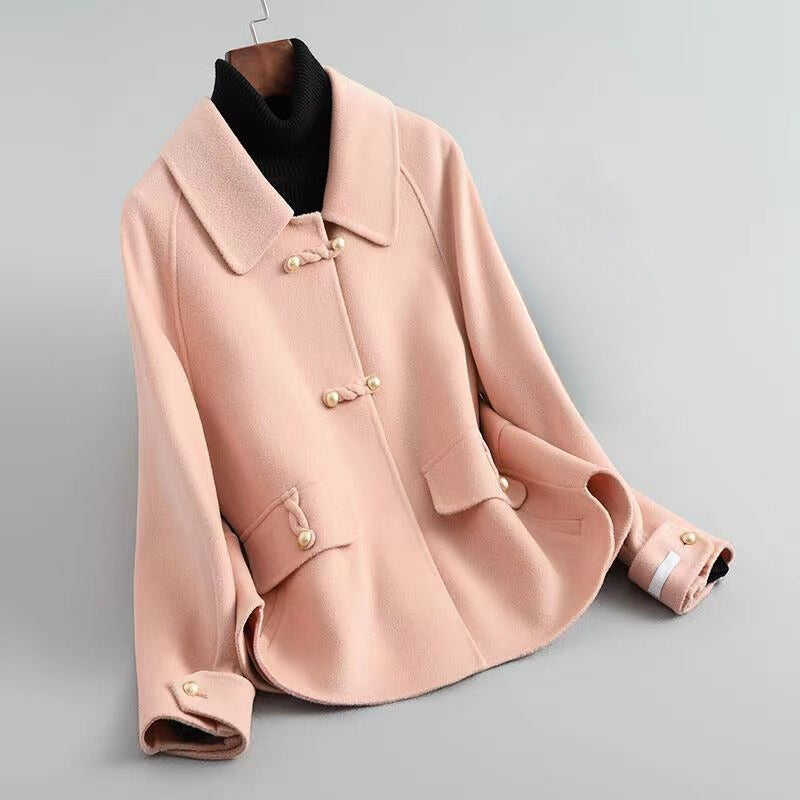 Women's beige knit coat with pearl buttons and statement collar