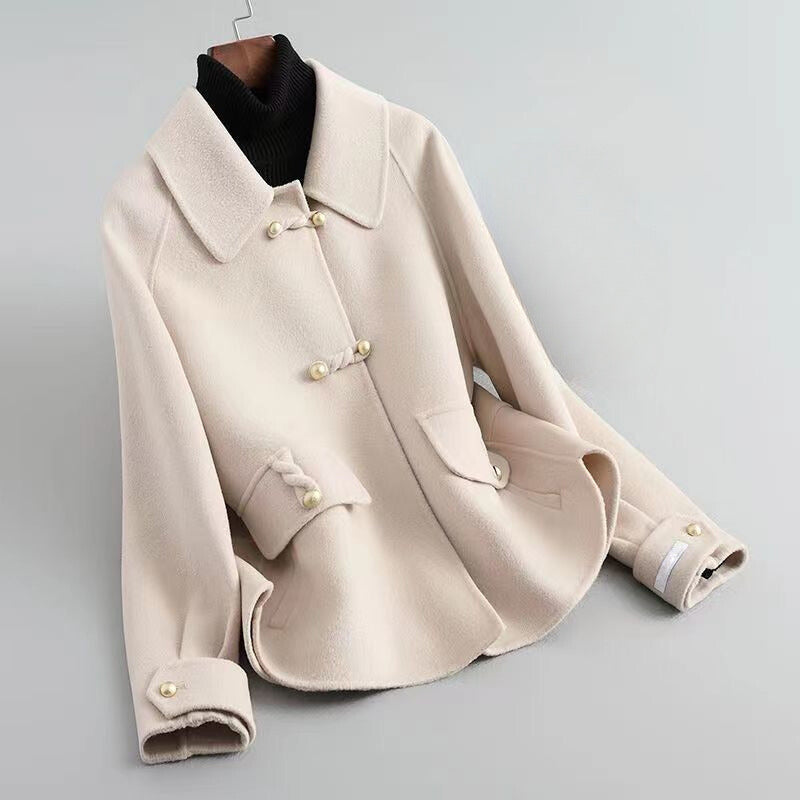 Women's beige knit coat with pearl buttons and statement collar