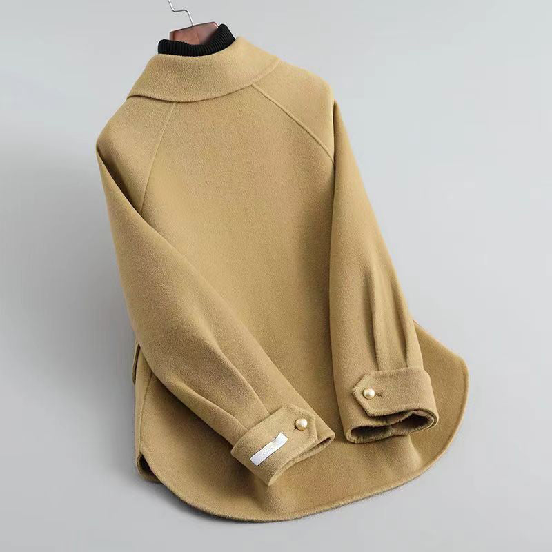 Women's beige knit coat with pearl buttons and statement collar