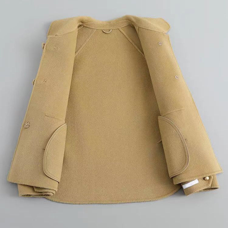 Women's yellow knit coat with pearl buttons and statement collar