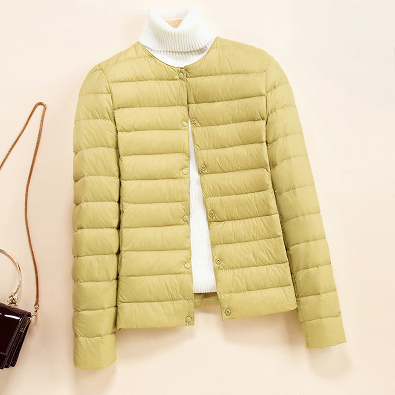 Women's blue lightweight quilted down jacket with round neck and snap front