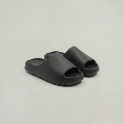 Men's green slide sandals with textured tread sole
