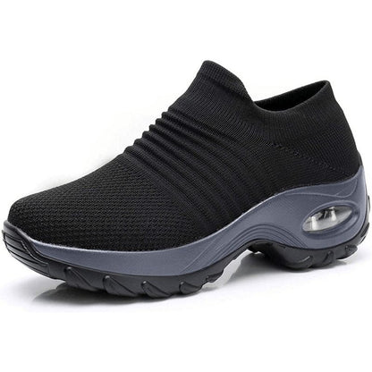 Women's black slip-on walking sneakers with grey air cushion sole