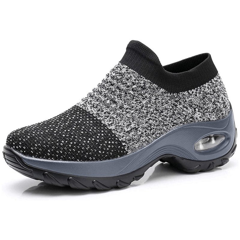 Women's black slip-on walking sneakers with grey air cushion sole