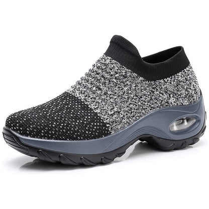 Women's black slip-on walking sneakers with grey air cushion sole