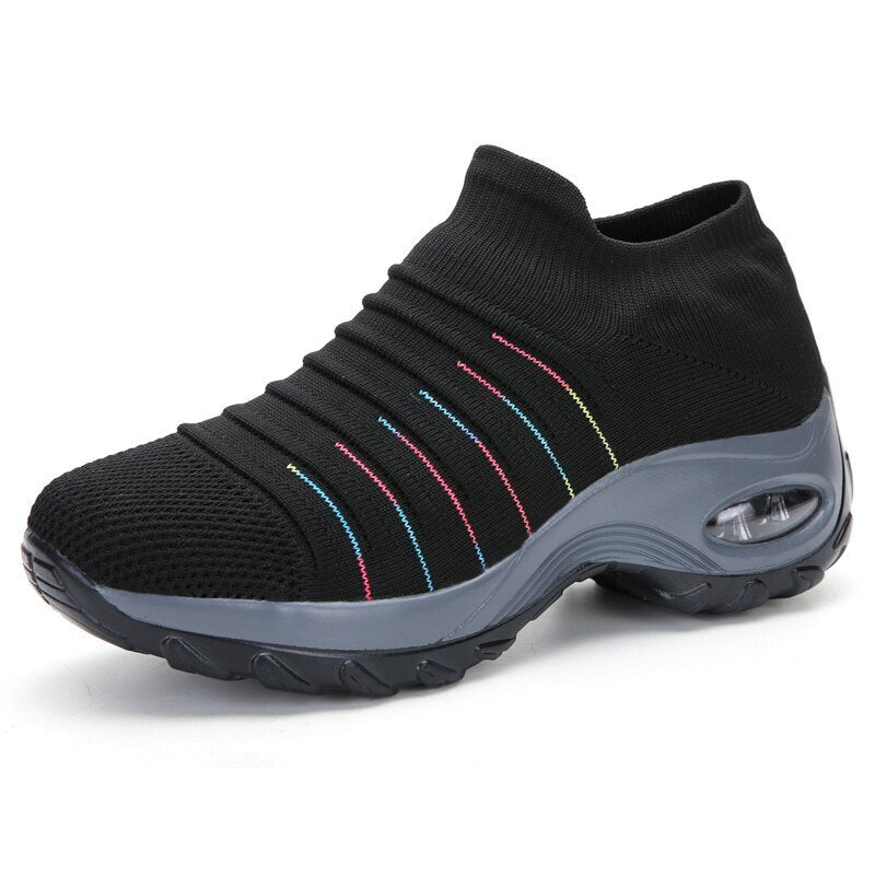 Women's black slip-on walking sneakers with grey air cushion sole
