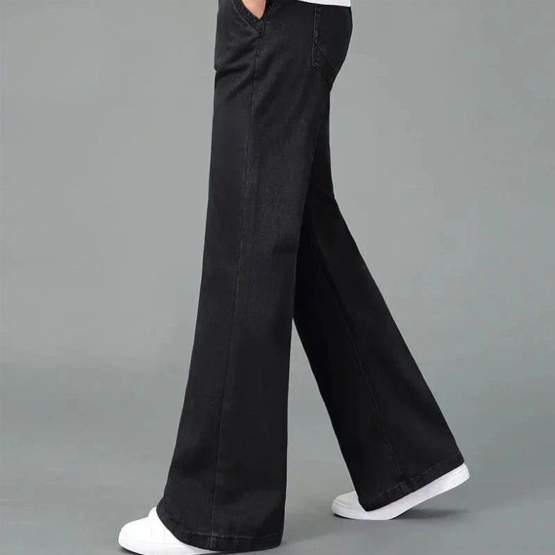 Men's light blue bootcut flare jeans in premium denim with reinforced stitching