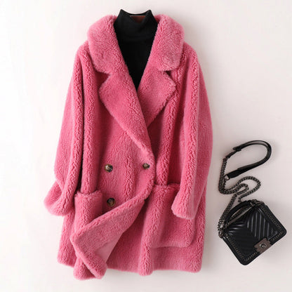 Women's pink oversized faux shearling coat with double breasted front