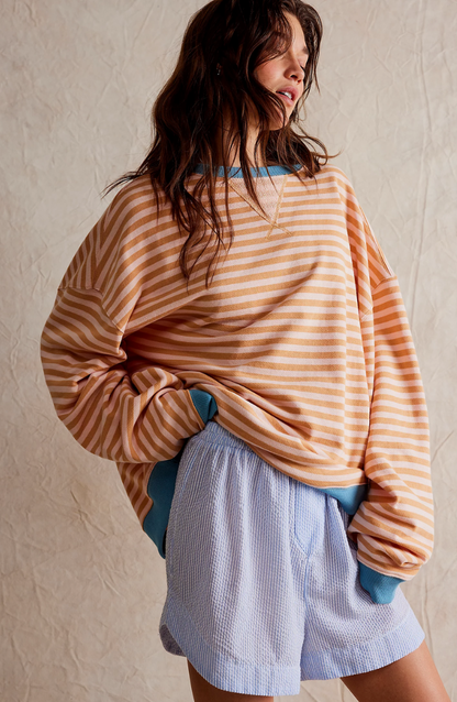 Women's striped oversized sweater in orange stripes