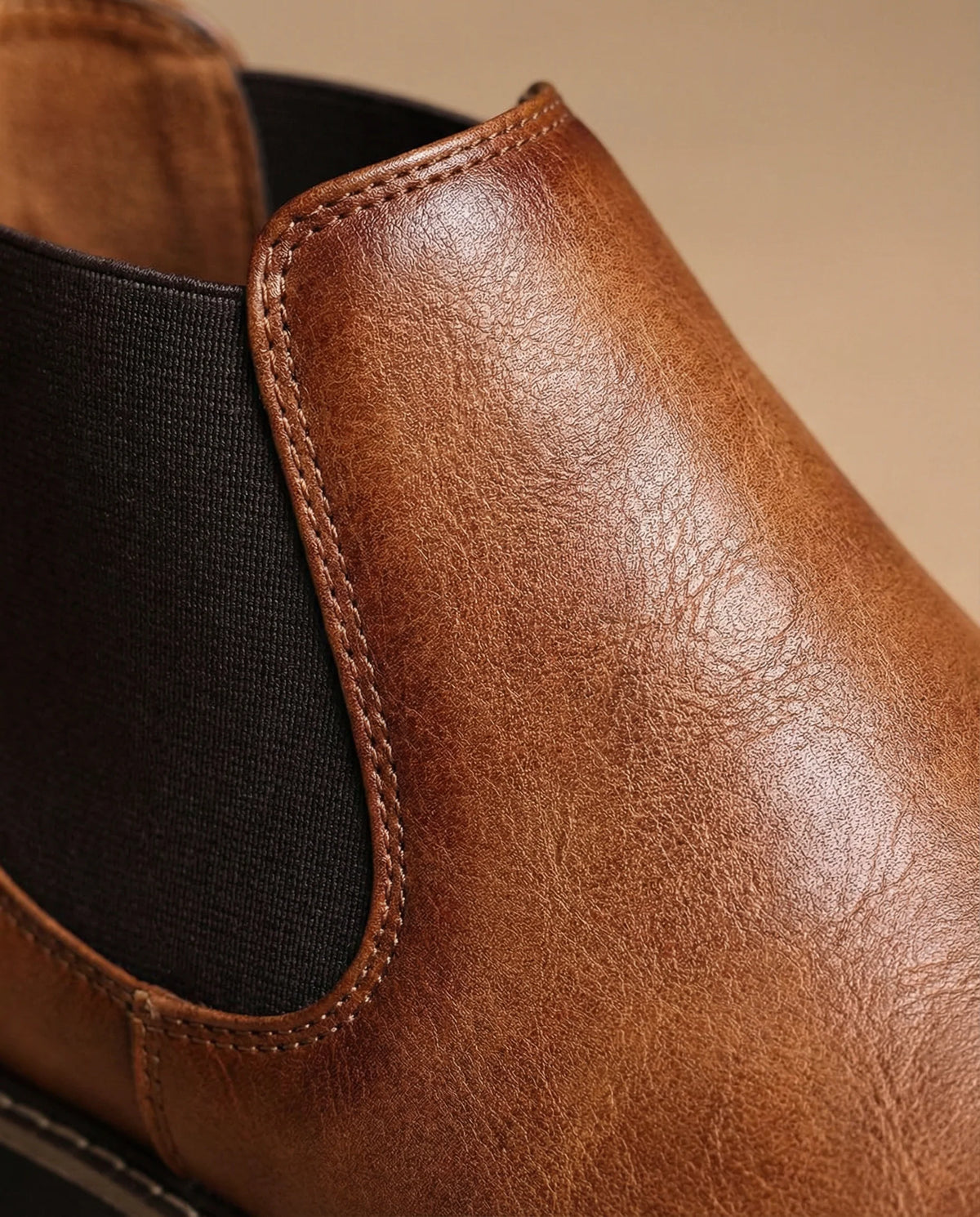 Men's brown leather boots, side profile