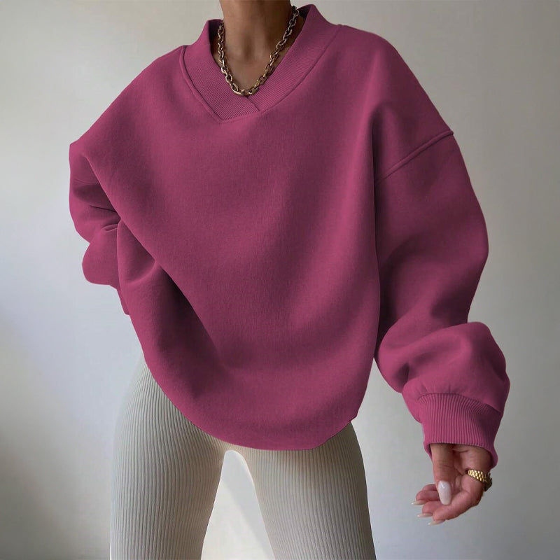 Women's light pink oversized v neck sweatshirt with ribbed cuffs