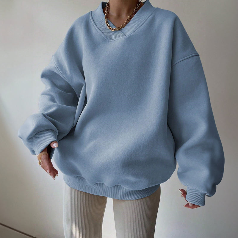 Women's light pink oversized v neck sweatshirt with ribbed cuffs