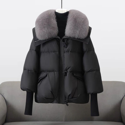 Women's black longline puffer jacket with faux fur collar