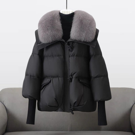Women's black longline puffer jacket with faux fur collar