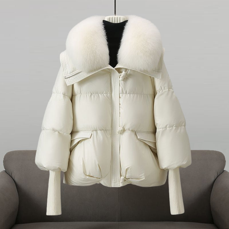 Women's black longline puffer jacket with faux fur collar
