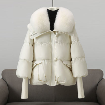 Women's black longline puffer jacket with faux fur collar