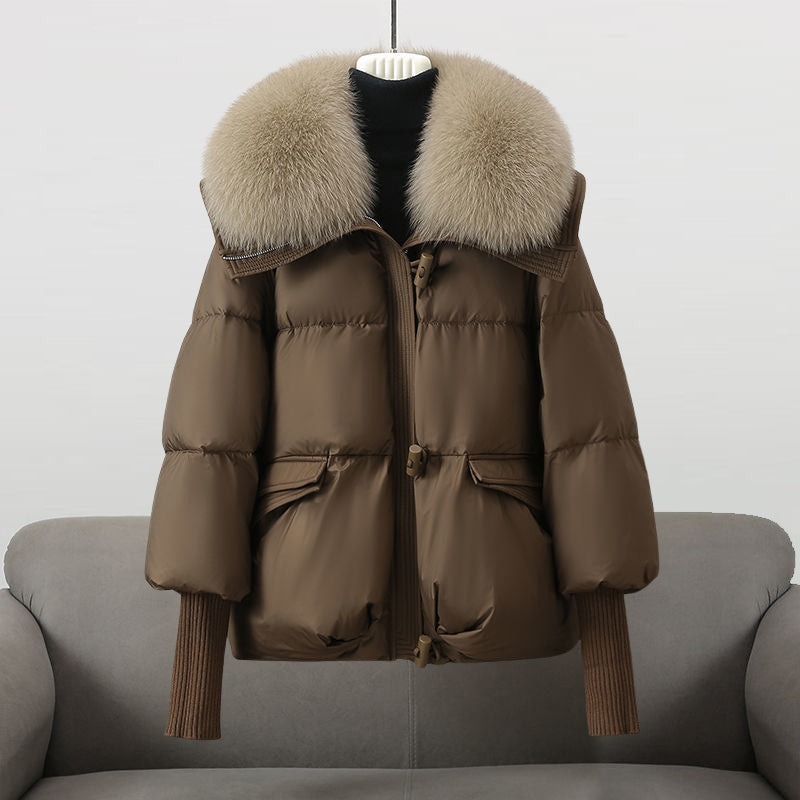 Women's black longline puffer jacket with faux fur collar