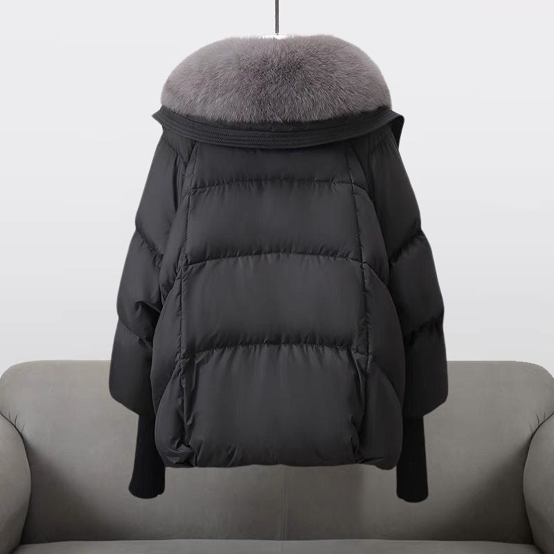 Women's black longline puffer jacket with faux fur collar