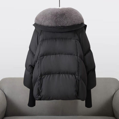 Women's black longline puffer jacket with faux fur collar